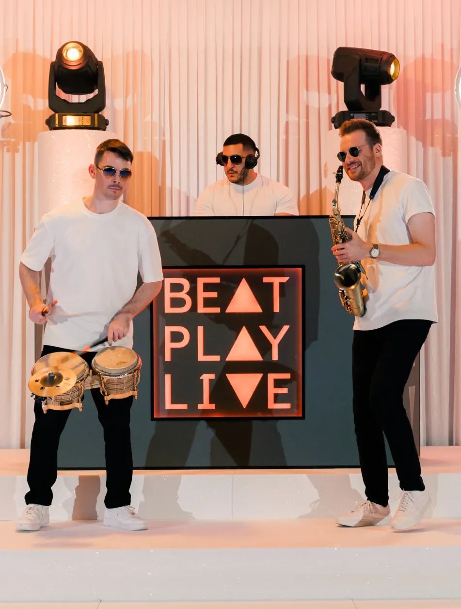 The BeatPlayLive trio with percussion, DJ booth and saxophone